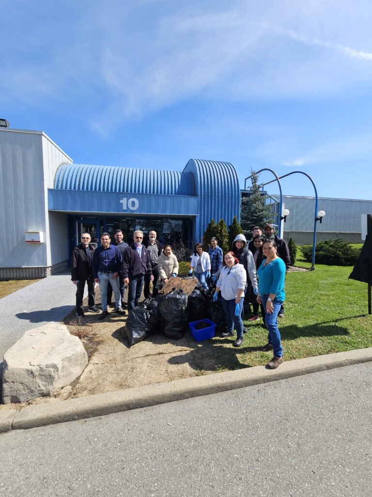 Employees collecting debris in celebration of Earth Day