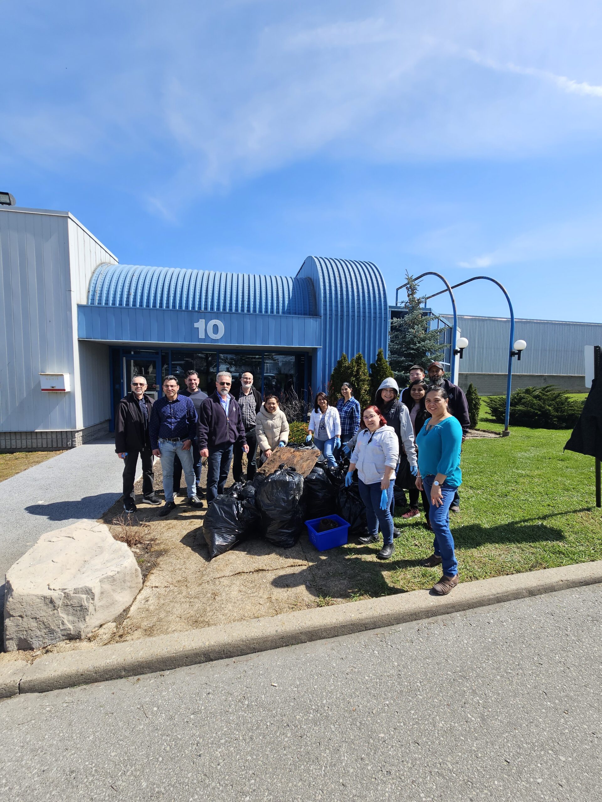 Employees collecting debris in celebration of Earth Day