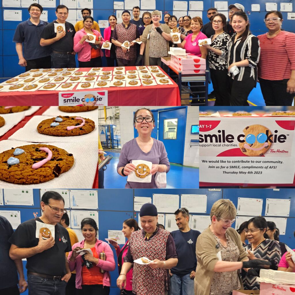 Employees eating Smile Cookies