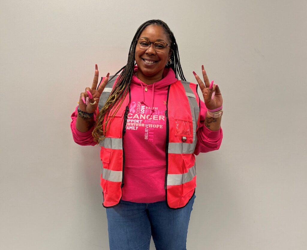 Employee wearing pink to support breast cancer